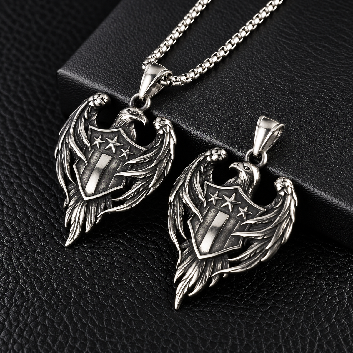 Front and reverse views of the silver-tone eagle pendant